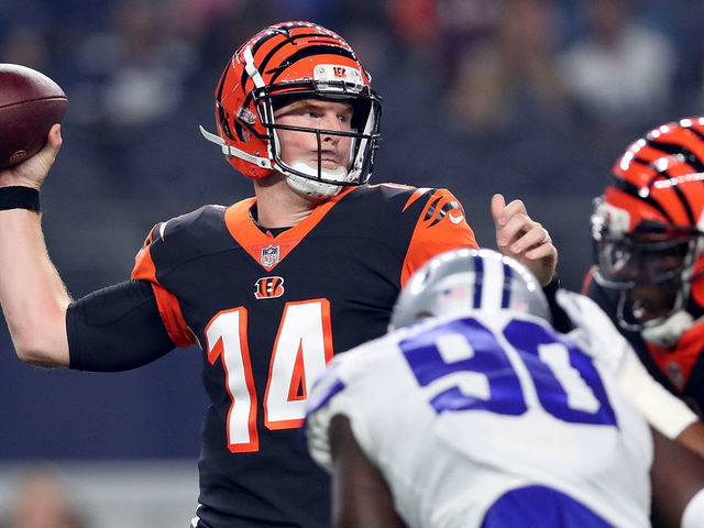 ARLINGTON, TX - AUGUST 18: Andy Dalton #14 of the Cincinnati Bengals looks for an open receiver against the Dallas Cowboys in the first quarter at AT&T Stadium on August 18, 2018 in Arlington, Texas.