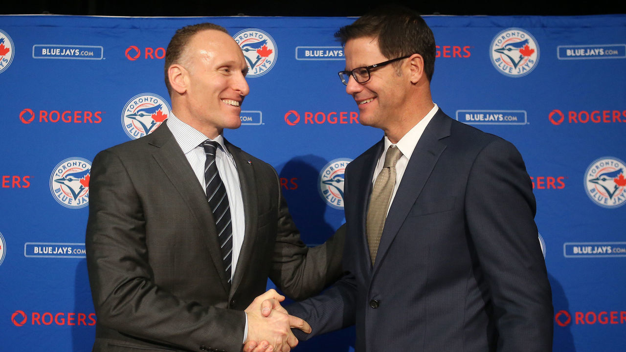 TORONTO, CANADA - DECEMBER 4: President Mark Shapiro and Ross Atkins pose for a photo after speaking to the media as Atkins is introduced as the new general manager of the Toronto Blue Jays during a press conference on December 4, 2015 at Rogers Centre in Toronto, Ontario, Canada.