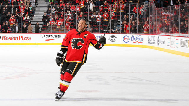 CALGARY, CANADA - MARCH 13: Jarome Iginla #12 of the Calgary Flames salutes the crowd after a 3-2 overtime win against the San Jose Sharks on March 13, 2012 at the Scotiabank Saddledome in Calgary, Alberta, Canada.