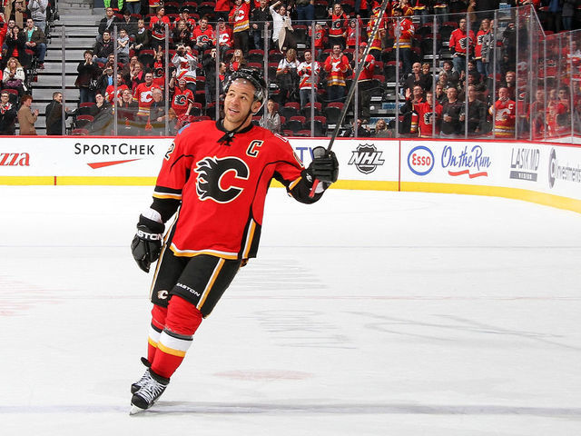 CALGARY, CANADA - MARCH 13: Jarome Iginla #12 of the Calgary Flames salutes the crowd after a 3-2 overtime win against the San Jose Sharks on March 13, 2012 at the Scotiabank Saddledome in Calgary, Alberta, Canada.