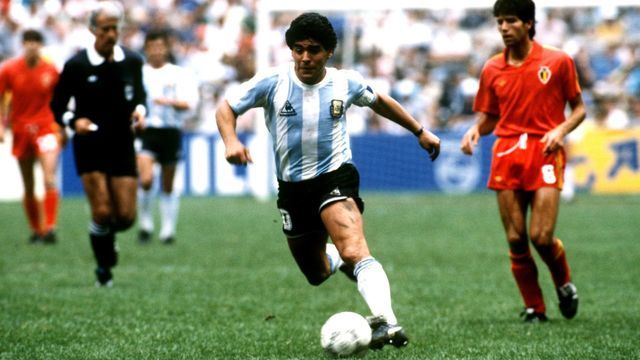 Argentina's Diego Maradona cuts through the Belgium defence