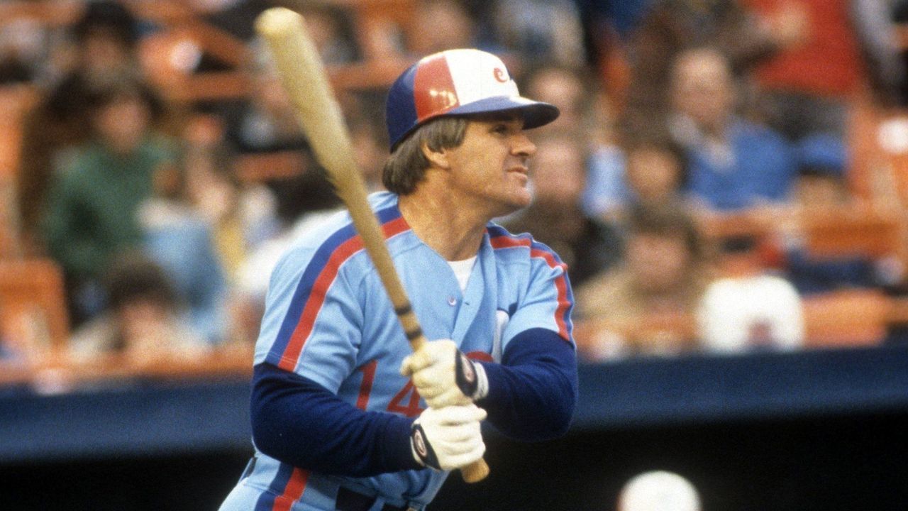 FLUSHING, NY - APRIL, 1984: Pete Rose #14 of the Montreal Expos swings at a pitch during an MLB game against the New York Mets in April, 1984 at Shea Stadium in Flushing, New York.