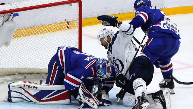 ST PETERSBURG, RUSSIA - SEPTEMBER 28, 2019: SKA St Petersburg's goaltender Alexei Melnichuk (L) and player Kirill Marchenko (R) defend against Dynamo Moscow's Ivan Igumnov in a 2019/2020 KHL Regular Season ice hockey match between SKA St Petersburg and Dynamo Moscow at Ledovy Dvorets Arena (Ice Palace). Alexander Demianchuk/TASS
