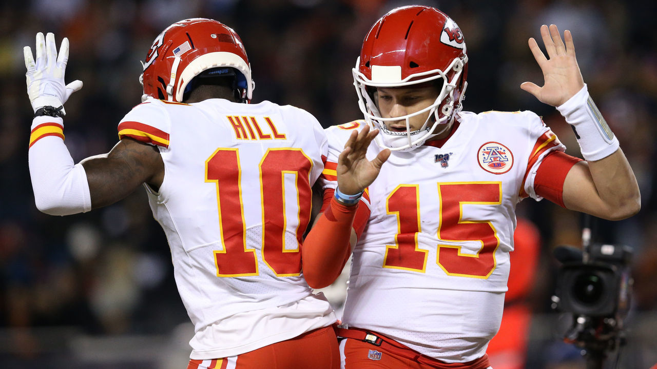 CHICAGO, ILLINOIS - DECEMBER 22: Quarterback Patrick Mahomes #15 of the Kansas City Chiefs celebrates with teammate wide receiver Tyreek Hill #10 after scoring a touchdown against the Chicago Bears in the first quarter of the game at Soldier Field on December 22, 2019 in Chicago, Illinois.