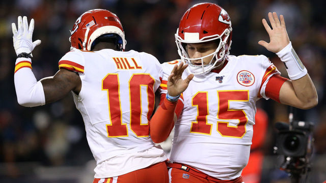 CHICAGO, ILLINOIS - DECEMBER 22: Quarterback Patrick Mahomes #15 of the Kansas City Chiefs celebrates with teammate wide receiver Tyreek Hill #10 after scoring a touchdown against the Chicago Bears in the first quarter of the game at Soldier Field on December 22, 2019 in Chicago, Illinois.