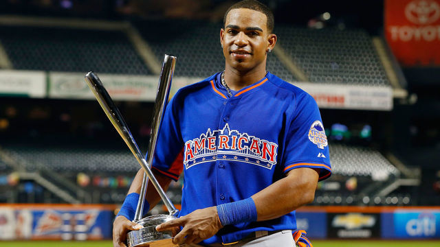 NEW YORK, NY - JULY 15: Yoenis Cespedes of the Oakland Athletics celebrates with the trophy after winning the Chevrolet Home Run Derby on July 15, 2013 at Citi Field in the Flushing neighborhood of the Queens borough of New York City.