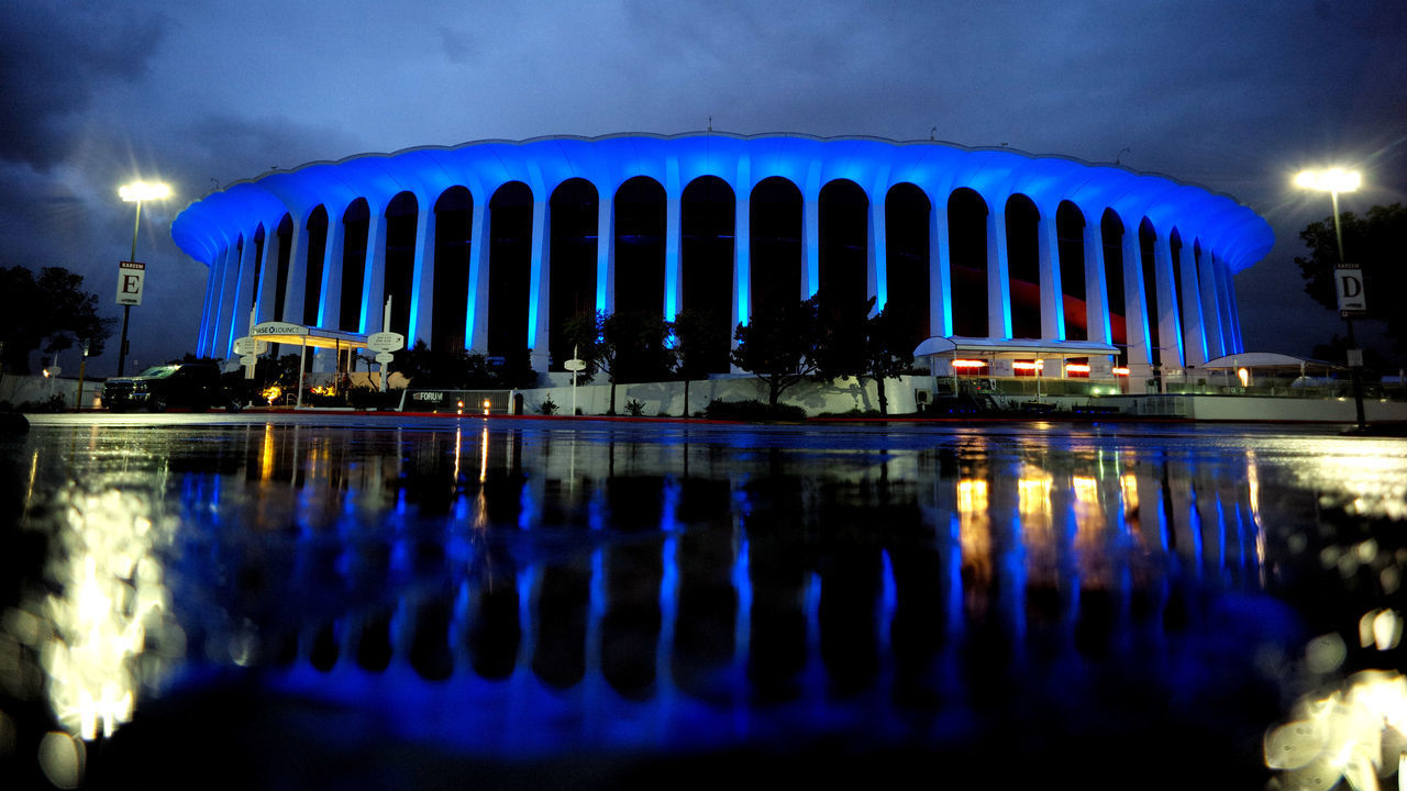 INGLEWOOD, CA - APRIL 09: The Forum turns blue as the the #LightItBlue initiative is nationwide collective salute to the millions of essential workers on the frontlines of the coronavirus pandemic. City skylines across the country will transform into a beacon of blue at 8 p.m. as more than 100 major sporting and entertainment venues, national landmarks and historic buildings from coast to coast will use existing LED technology to illuminate in blue in Inglewood on Thursday, April 9, 2020.