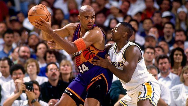 OAKLAND, CA - MAY 4: Charles Barkley #34 of the Phoenix Suns posts up against Chris Gatling #25 of the Golden State Warriors during Game Three of the Western Conference Quarterfinals on May 4, 1994 at the Oakland Coliseum in Oakland, California. Barkley scored 56 points during this game. NOTE TO USER: User expressly acknowledges that, by downloading and or using this photograph, User is consenting to the terms and conditions of the Getty Images License agreement. Mandatory Copyright Notice: Copyright 1993 NBAE