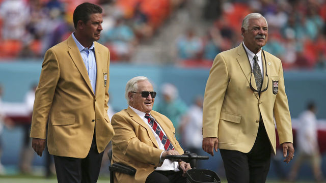 MIAMI GARDENS, FL - DECEMBER 21: Miami Dolphins greats (L to R) Dan Marino Don Shula and Larry Csonka are shown on the field before the Dolphins met the Minnesota Vikings in a game at Sun Life Stadium on December 21, 2014 in Miami Gardens, Florida.