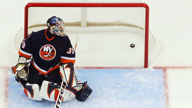UNIONDALE, NY - APRIL 12: Goalie Rick DiPietro #39 of the New York Islanders lets a goal in by Martin St. Louis #26 of the Tampa Bay Lightning in the first period during the first period of game three of their first round playoff series on April 12, 2004 at the Nassau Coliseum in Uniondale, New York.