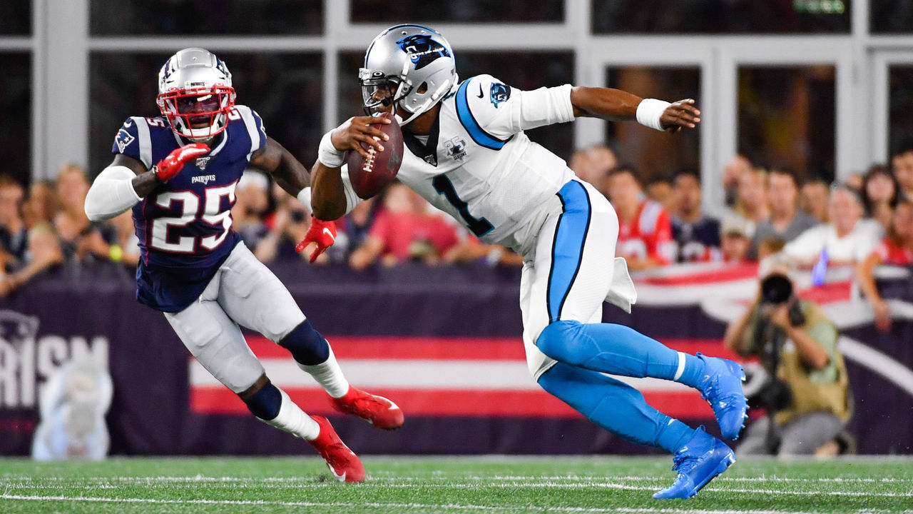 FOXBOROUGH, MA - AUGUST 22: Cam Newton #1 of the Carolina Panthers runs with the ball in the first quarter of a preseason game against Terrence Brooks #25 of the New England Patriots at Gillette Stadium on August 22, 2019 in Foxborough, Massachusetts.