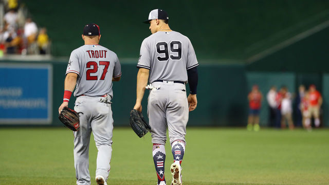 WASHINGTON, D.C. - JULY 17: Mike Trout #27 of the Los Angeles Angels and Aaron Judge #99 of the New York Yankees walk to the outfield during the 89th MLB All-Star Game at Nationals Park on Tuesday, July 17, 2018 in Washington, D.C.
