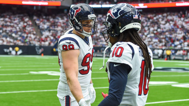 HOUSTON, TX - SEPTEMBER 23: Houston Texans defensive end J.J. Watt (99) congratulates wide receiver DeAndre Hopkins (10) during the football game between the New York Giants and Houston Texans on September 23, 2018 at NRG Stadium in Houston, TX.