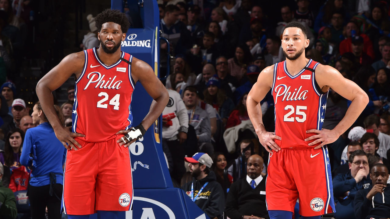 PHILADELPHIA, PA - JANUARY 28: Joel Embiid #21 of the Philadelphia 76ers, wearing #24 to honor Kobe Bryant, and Ben Simmons #25 of the Philadelphia 76ers look on during a game against the Golden State Warriors on January 28, 2020 at the Wells Fargo Center in Philadelphia, Pennsylvania NOTE TO USER: User expressly acknowledges and agrees that, by downloading and/or using this Photograph, user is consenting to the terms and conditions of the Getty Images License Agreement. Mandatory Copyright Notice: Copyright 2020 NBAE