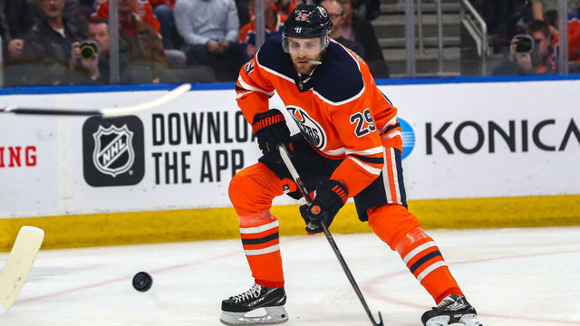EDMONTON, AB - MARCH 11: Edmonton Oilers Center Leon Draisaitl (29) shoots a loose puck in the first period during the Edmonton Oilers game versus the Winnipeg Jets on March 11, 2020 at Rogers Place in Edmonton, AB.