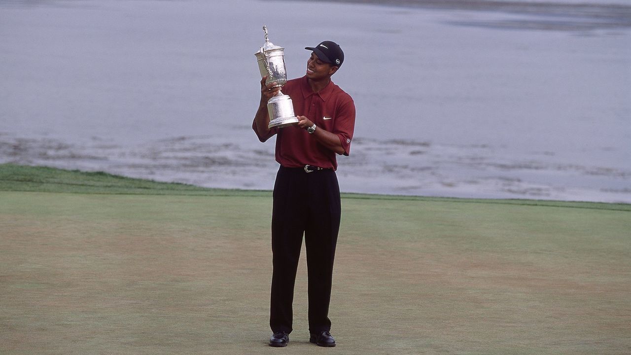 18 Jun 2000: Tiger Woods of the USA poses with the winning trophy after winning the 100th US Open held at the Pebble Beach Golf Links, in Pebble Beach, California. \ Mandatory Credit: David Cannon /Allsport