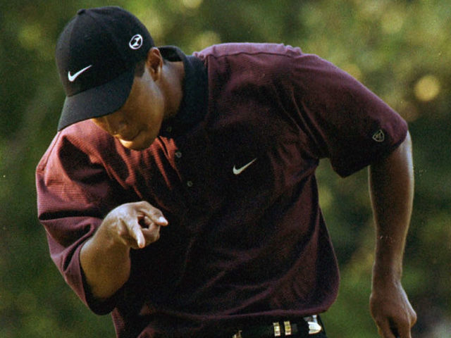 376403 05: Tiger Woods reacts after making a putt on the first hole of the playoff August 20, 2000 during the PGA Championship at the Valhalla Golf Club in Louisville, Ky. Woods defeated Bob May in the playoff to win the tournament, becoming the first player since Ben Hogan in 1953 to win three majors in one year.