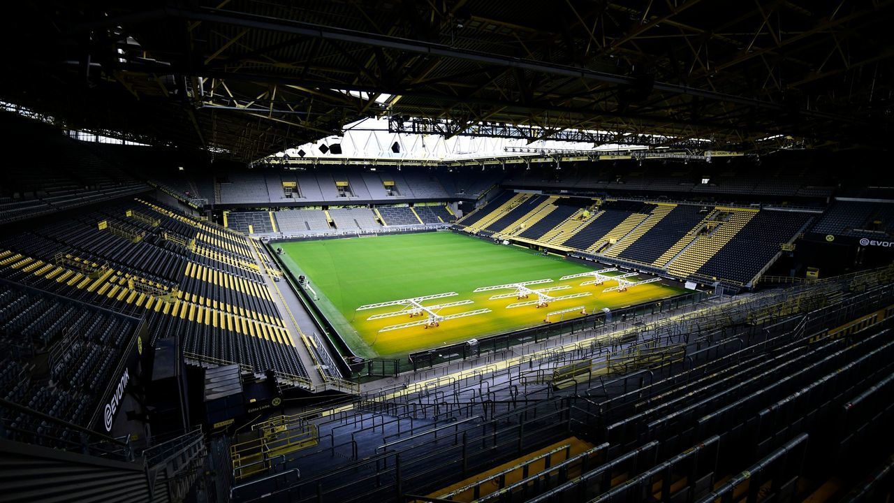 The empty stadium Signal Iduna Park of the Bundesliga club Borussia Dortmund is pictured in Dortmund, western Germany, on May 5, 2020, due to the spread of the novel coronavirus COVID-19. - German football is waiting for the green light as during Chancellor Angela Merkel's crucial meeting with the Presidents of the Lander (regional states) on May 6, 2020 will be decided whether or not to allow the Bundesliga to resume, behind closed doors and on the basis of a draconian health protocol.
