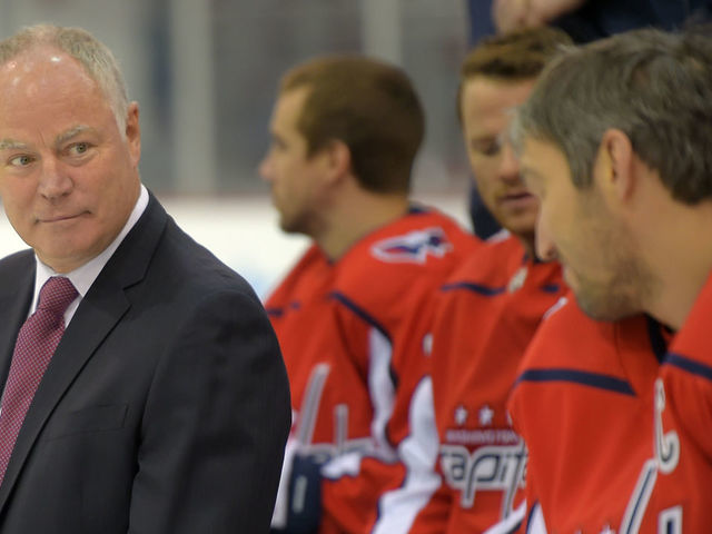 ARLINGTON, VA - APRIL 3: Washington Capitals GM Brian MacLellan ,left, talks to Alex Ovechkin,, right, during a team photo shoot at their practice facility in Arlington, VA on April 3, 2019 .
