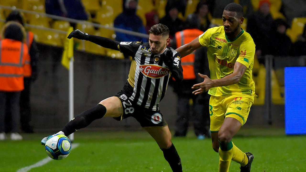 Angers' Algerian forward Farid El Melali (L) fights for the ball with Nantes' Malian defender Molla Wague during the French L1 football match between FC Nantes (FCN) and Angers SCO (ASCO) at La Beaujoire Stadium in Nantes, western France, on December 21, 2019.