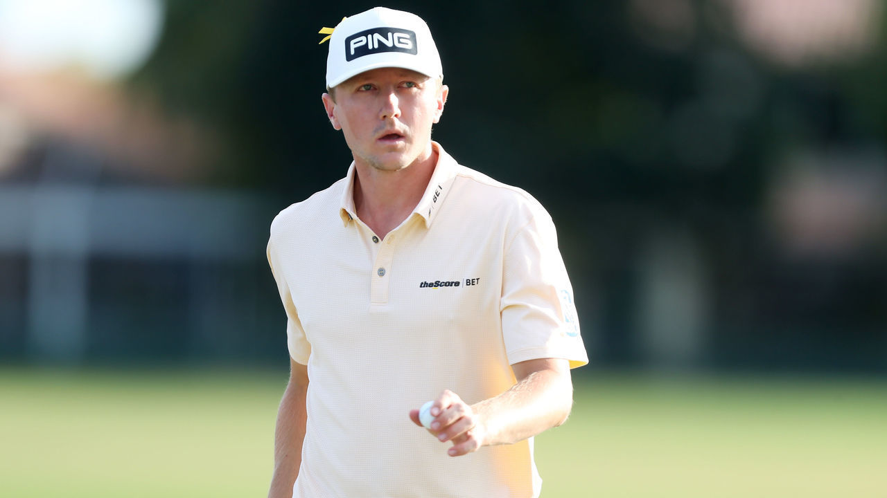 PALM BEACH GARDENS, FLORIDA - MARCH 01: MacKenzie Hughes of Canada waves to the gallery after a putt on the 14th hole during the Honda Classic at PGA National Resort and Spa Champion course on March 01, 2020 in Palm Beach Gardens, Florida.