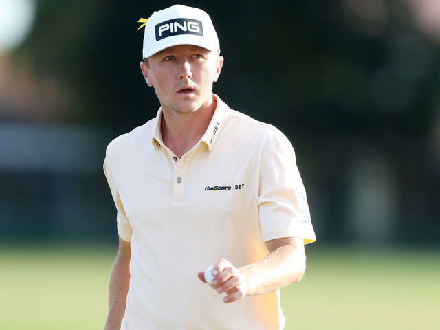 PALM BEACH GARDENS, FLORIDA - MARCH 01: MacKenzie Hughes of Canada waves to the gallery after a putt on the 14th hole during the Honda Classic at PGA National Resort and Spa Champion course on March 01, 2020 in Palm Beach Gardens, Florida.