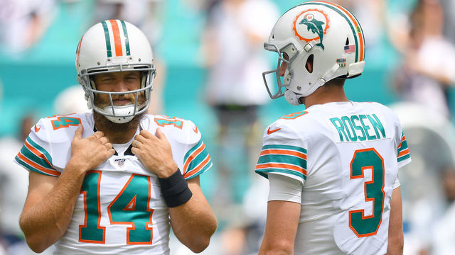 MIAMI, FLORIDA - SEPTEMBER 15: Ryan Fitzpatrick #14 and Josh Rosen #3 of the Miami Dolphins warm up prior to the game against the New England Patriots at Hard Rock Stadium on September 15, 2019 in Miami, Florida.
