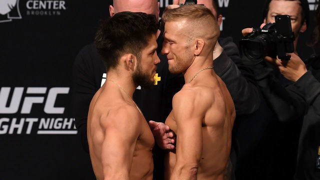 BROOKLYN, NEW YORK - JANUARY 18: (L-R) Henry Cejudo and TJ Dillashaw face off during the UFC Fight Night weigh-in iat Barclays Center on January 18, 2019 in the Brooklyn borough of New York City.