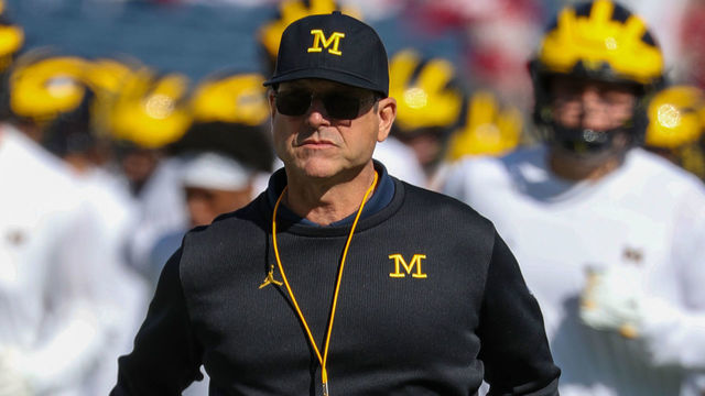 ORLANDO, FL - JANUARY 01: Michigan Wolverines head coach Jim Harbaugh runs off the field during warm ups before the VRBO Citrus Bowl between The Alabama Crimson Tide and the Michigan Wolverines on January 01, 2020, at Camping World Stadium in Orlando FL.