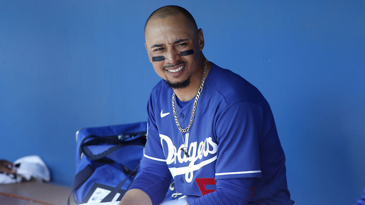 GLENDALE, ARIZONA - FEBRUARY 24: Mookie Betts #50 of the Los Angeles Dodgers looks on from the dugout prior to a Cactus League spring training game against the Chicago White Sox at Camelback Ranch on February 24, 2020 in Glendale, Arizona.