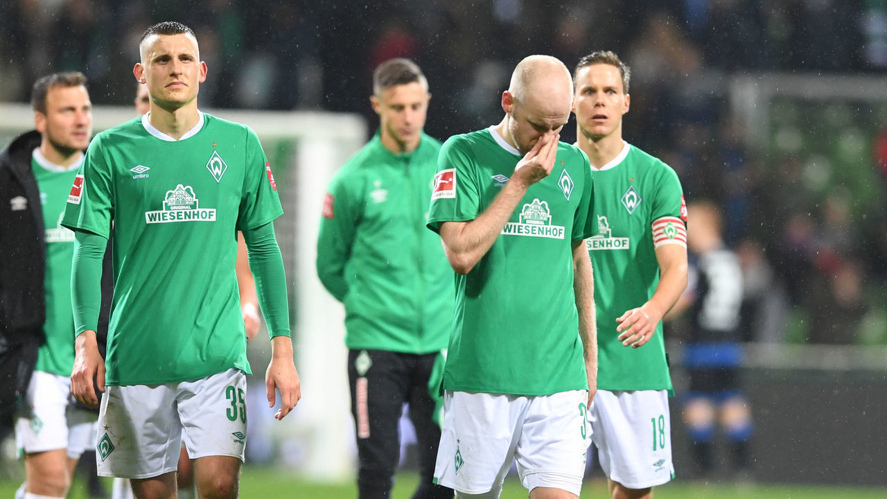 08 December 2019, Bremen: Soccer: Bundesliga, Werder Bremen - SC Paderborn 07, 14th matchday. Werders players (l-r) Maximilian Eggestein, Davy Klaassen and Niklas Moisander cross the court after the defeat. Photo: Carmen Jaspersen/dpa - IMPORTANT NOTE: In accordance with the requirements of the DFL Deutsche Fußball Liga or the DFB Deutscher Fußball-Bund, it is prohibited to use or have used photographs taken in the stadium and/or the match in the form of sequence images and/or video-like photo sequences.