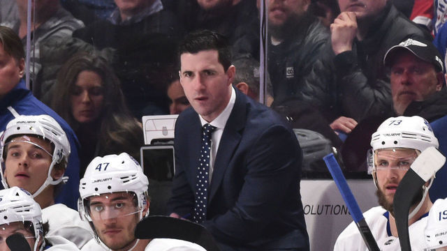 MONTREAL, QC - FEBRUARY 08: Assistant coach Paul McFarland (L) and head coach of the Toronto Maple Leafs Sheldon Keefe (R) look on from behind the bench against the Montreal Canadiens during the second period at the Bell Centre on February 8, 2020 in Montreal, Canada. The Montreal Canadiens defeated the Toronto Maple Leafs 2-1 in overtime.