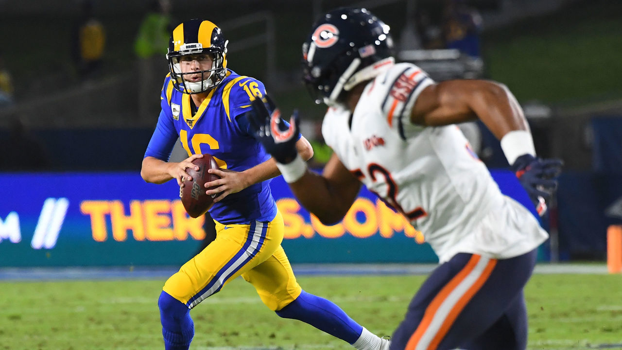 LOS ANGELES, CA - NOVEMBER 17: Quarterback Jared Goff #16 of the Los Angeles Rams looks for an open receiver as he scrambles in the game against the Chicago Bears at the Los Angeles Memorial Coliseum on November 17, 2019 in Los Angeles, California.
