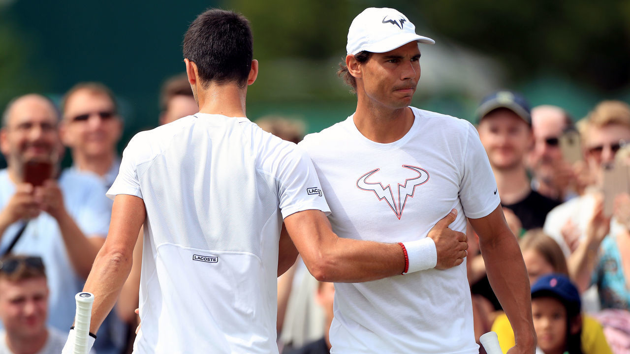 Rafael Nadal (right) and Novak Djokovic during a practice session on day nine of the Wimbledon Championships at the All England Lawn Tennis and Croquet Club, Wimbledon.