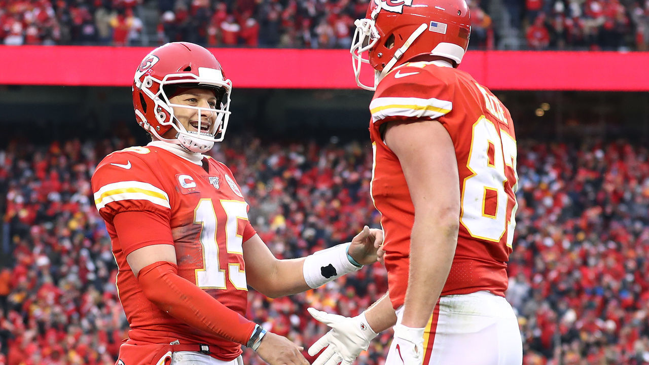 KANSAS CITY, MISSOURI - JANUARY 12: Patrick Mahomes #15 of the Kansas City Chiefs is congratulated by his teammate Travis Kelce #87 after a third quarter touchdown against the Houston Texans in the AFC Divisional playoff game at Arrowhead Stadium on January 12, 2020 in Kansas City, Missouri.