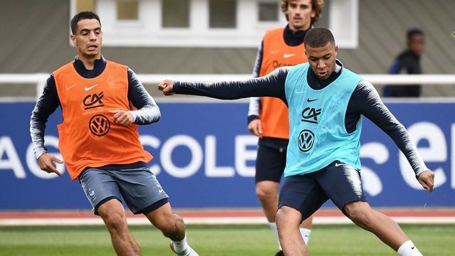 France's forward Wissam Ben Yedder (L) vies with France's forward Kylian Mbappe during a traning session in Clairefontaine-en-Yvelines on May 30, 2019 as part of the team's preparation for the UEFA Euro 2020 qualifying Group H matches against Turkey and Andorra.