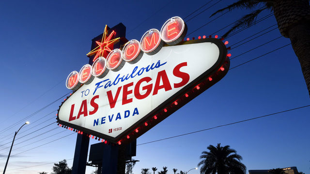 LAS VEGAS, NEVADA - MAY 05: Red lights flicker around the Welcome to Fabulous Las Vegas sign as part of a "red takeover" coinciding with the 37th National Travel and Tourism Week (NTTW) amid the coronavirus pandemic on May 5, 2020 in Las Vegas, Nevada. The U.S. Travel Association canceled IPW, its international trade show that was to be held in Las Vegas later this month, due to the spread of COVID-19. Chicago was scheduled to host IPW in 2021 but agreed to step aside to let Las Vegas hold the show next year, recognizing the city's reliance on tourism, travel and gaming. Today, because of the coronavirus's impact on travel, the association hosted its first-ever virtual road trip in support of NTTW’s "Spirit of Travel" campaign, which highlights the industry's resilience and eventual economic recovery in the face of the pandemic. On Tuesday evening, The Las Vegas Convention and Visitors Authority had hotel-casinos and attractions along the Las Vegas Strip and in downtown Las Vegas lit red, this year's official color of NTTW, in a show of solidarity.