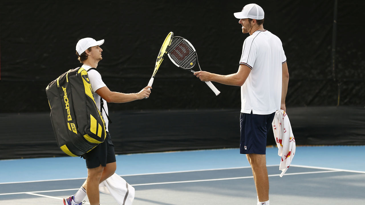 WEST PALM BEACH, FLORIDA - MAY 09: Miomir Kecmanovic of Serbia and Reilly Opelka of the United States tap their rackets together after their match in the UTR Pro Match Series Day 2 on May 09, 2020 in West Palm Beach, Florida.