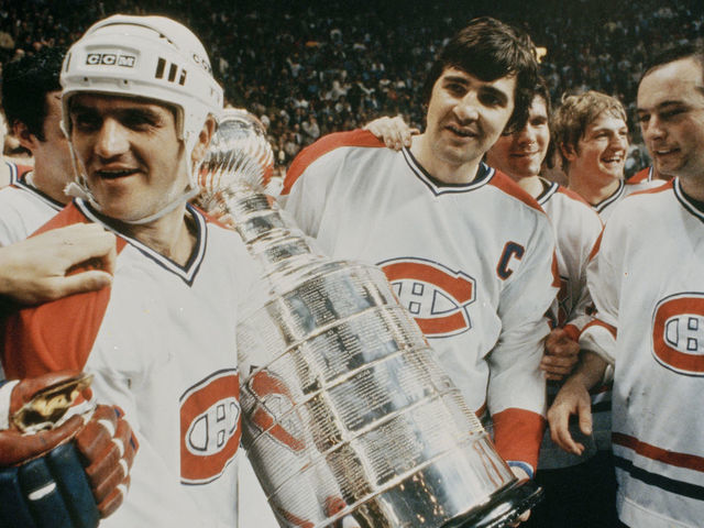 NEW YORK, NY - MAY 21: Jacques Lemaire #25, Serge Savard #18 and Steve Shutt #22 of the Montreal Canadiens celebrate on the ice with the Stanley Cup after defeating the New York Rangers in Game 5 of the Stanley Cup Final at Madison Square Garden on May 21, 1979 in New York City.