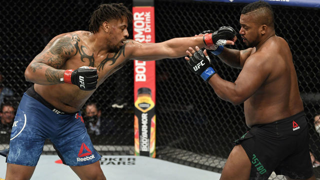 JACKSONVILLE, FLORIDA - MAY 09: (L-R) Greg Hardy punches Yorgan De Castro in their heavyweight fight during the UFC 249 event at VyStar Veterans Memorial Arena on May 09, 2020 in Jacksonville, Florida.