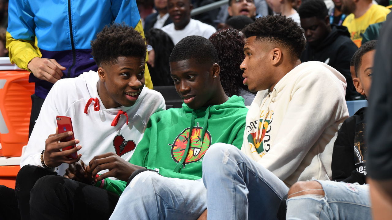 CHARLOTTE, NC - FEBRUARY 16: Brothers Kostas Antetokounmpo, Alex Antetokounmpo and Giannis Antetokounmpo sit courtside during the 2019 AT&T Slam Dunk Contest as part of the State Farm All-Star Saturday Night on February 16, 2019 at the Spectrum Center in Charlotte, North Carolina. NOTE TO USER: User expressly acknowledges and agrees that, by downloading and/or using this photograph, user is consenting to the terms and conditions of the Getty Images License Agreement. Mandatory Copyright Notice: Copyright 2019 NBAE
