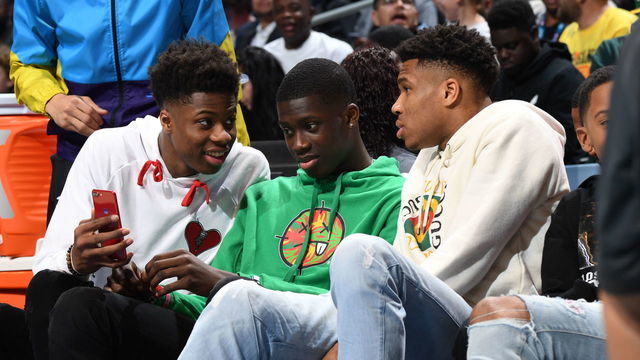 CHARLOTTE, NC - FEBRUARY 16: Brothers Kostas Antetokounmpo, Alex Antetokounmpo and Giannis Antetokounmpo sit courtside during the 2019 AT&T Slam Dunk Contest as part of the State Farm All-Star Saturday Night on February 16, 2019 at the Spectrum Center in Charlotte, North Carolina. NOTE TO USER: User expressly acknowledges and agrees that, by downloading and/or using this photograph, user is consenting to the terms and conditions of the Getty Images License Agreement. Mandatory Copyright Notice: Copyright 2019 NBAE