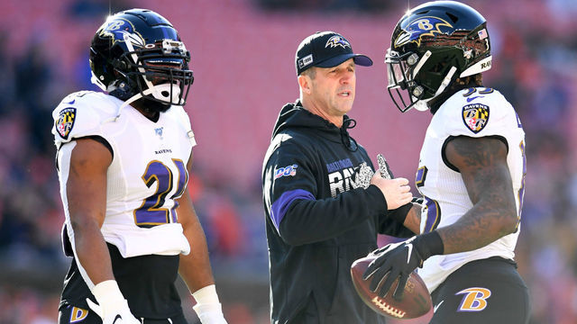CLEVELAND, OH - DECEMBER 22, 2019: Head coach John Harbaugh of the Baltimore Ravens talks with running backs Mark Ingram #21 and Gus Edwards #35 prior to a game against the Cleveland Browns on December 22, 2019 at FirstEnergy Stadium in Cleveland, Ohio. Baltimore won 31-15. (Photo by: 2019 Nick Cammett/Diamond Images via Getty Images)