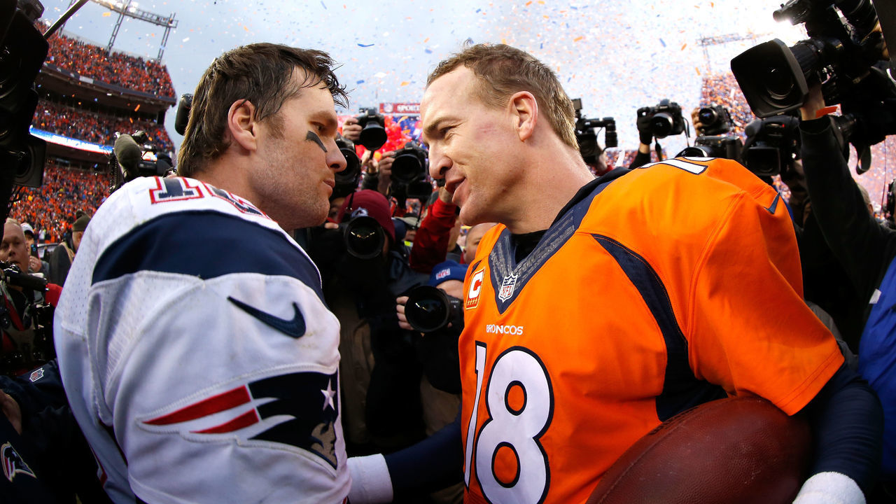 DENVER, CO - JANUARY 24: Peyton Manning #18 of the Denver Broncos and Tom Brady #12 of the New England Patriots speak after the AFC Championship game at Sports Authority Field at Mile High on January 24, 2016 in Denver, Colorado. The Broncos defeated the Patriots 20-18.