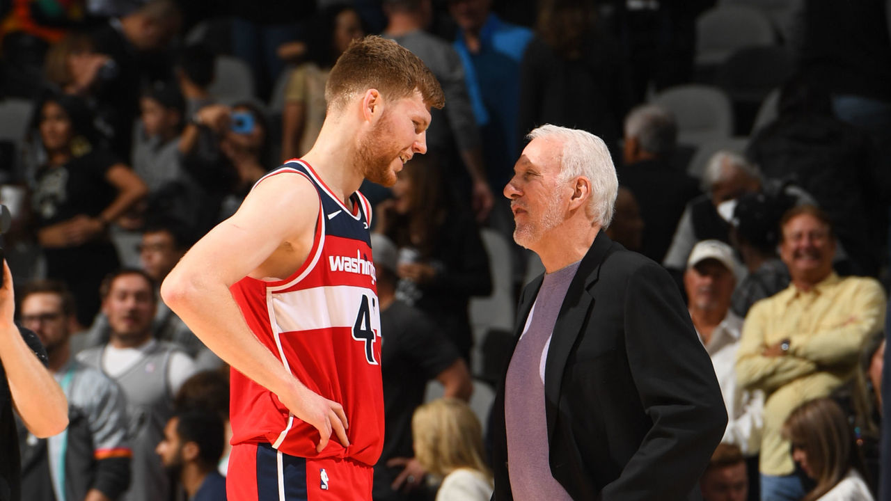 DENVER, CO - OCTOBER 26: Davis Bertans #42 of the Washington Wizards smiles with Head Coach Gregg Popovich of the Washington Wizards after a game against the San Antonio Spurs on October 26, 2019 at the Pepsi Center in Denver, Colorado. NOTE TO USER: User expressly acknowledges and agrees that, by downloading and/or using this Photograph, user is consenting to the terms and conditions of the Getty Images License Agreement. Mandatory Copyright Notice: Copyright 2019 NBAE