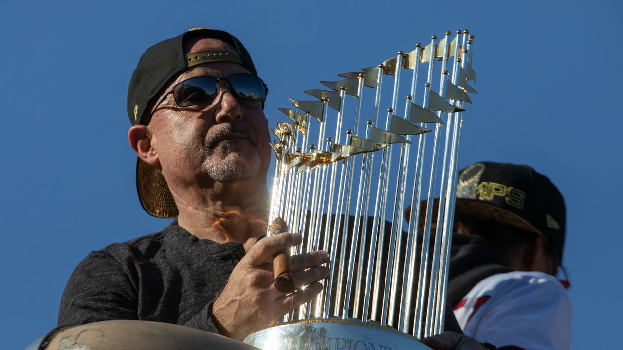 WASHINGTON,DC-NOV2: The World Series Trophy is held by Mike Rizzo on the parade route, November 2, 2019.