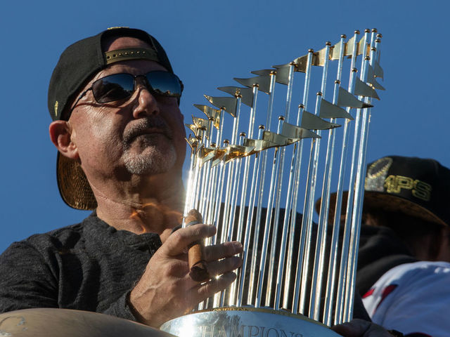 WASHINGTON,DC-NOV2: The World Series Trophy is held by Mike Rizzo on the parade route, November 2, 2019.