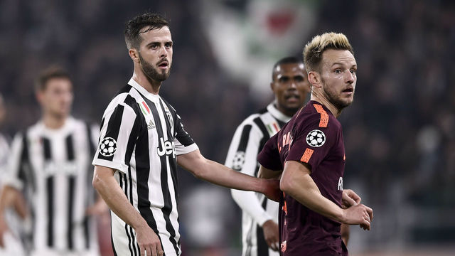 TURIN, ITALY - NOVEMBER 22: Miralem Pjanic and Ivan Rakitic during the UEFA Champions League group D match between Juventus and FC Barcelona at Allianz Stadium on November 22, 2017 in Turin, Italy.