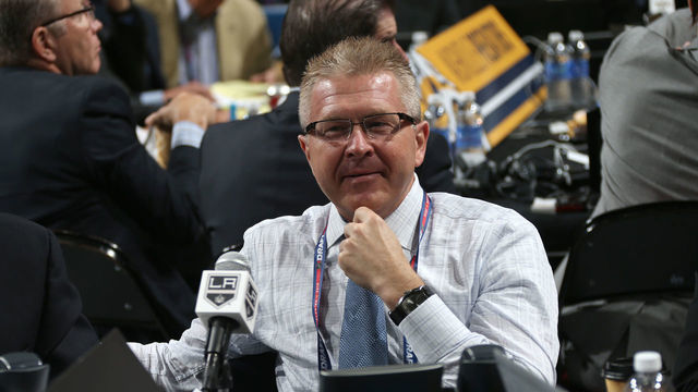 SUNRISE, FL - JUNE 27: Mike Futa, Vice President, Hockey Operations and Director of Player Personnel of the Los Angeles Kings, looks on from the draft table during the 2015 NHL Draft at BB&T Center on June 27, 2015 in Sunrise, Florida.