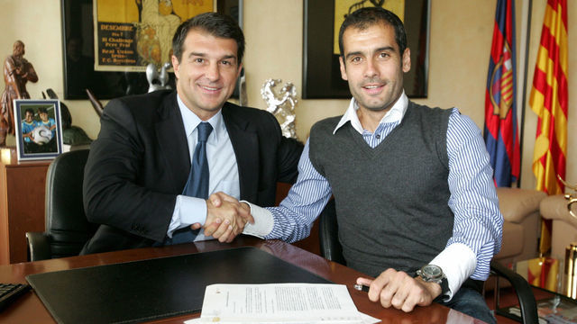 Barcelona president Joan Laporta (L) shakes hands with his new coach and former Barcelona player Pep Guardiola after he signed a two-year contract to coach the club on June 5, 2008 in Barcelona. Guardiola inherits a talented team including youngsters such as Lionel Messi and Bojan Krkic but there are sure to be summer exits as Guardiola looks to stamp his mark on the team. AFP PHOTO/HO/www.fcbarcelona.cat RESTRICTED TO EDITORIAL USE